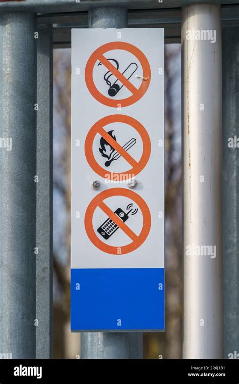 Signs For No Smoking Open Flame Or Cellphones In Gas Station Close Up