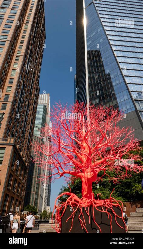 The Old Tree Is A Pink And Red 25 Foot Tall Sculpture Comprised Of Man