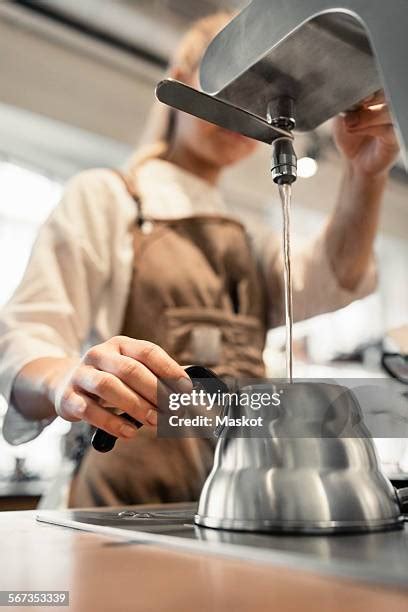 Woman Pouring Boiling Water Photos And Premium High Res Pictures