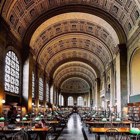 The Inside Of A Library With Tables And Chairs