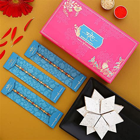 Traditional Pearl Studded Rakhi Trio And Kaju Katli Qatar Gift