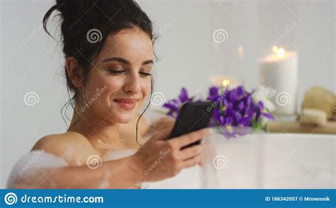 Ceerful Woman Getting Message On Smartphone In Bathtub Girl Messaging