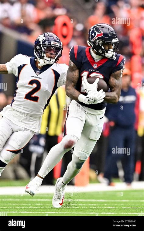 Houston Texans Wide Receiver Nico Collins Catches A Pass As Denver