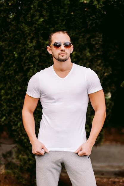 Premium Photo Portrait Of Man Wearing Sunglasses Standing In Park