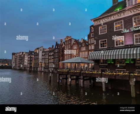 Damrak waterfront at night, Amsterdam Stock Photo - Alamy