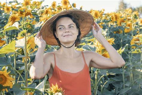 Beautiful Caucasian Woman In Sunflowers Portrait Of A Woman Wearing A