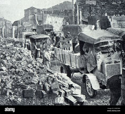 Convoy Passes Through The Ruined Buildings In Verdun After The Battle