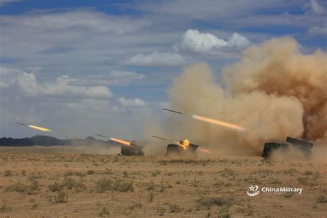 Vehicle-mounted 122mm rocket launcher systems attached to a combined brigade under the PLA 77th ...