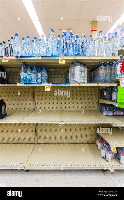 Nearly Empty Shelves In A Supermarket Grocery Store In The Bottled