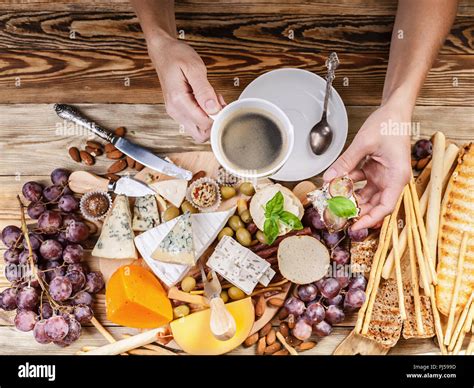 Female Hands Hold A Cup Of Coffee And Toast With Cheese Stock Photo Alamy