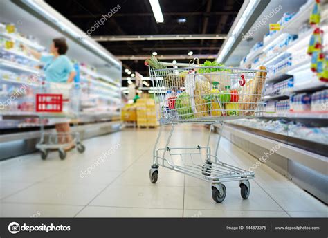 Shopping cart full of grocery — Stock Photo © pressmaster #144873375