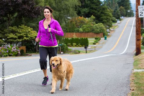 Woman Running With Her Dog Stock Foto Adobe Stock