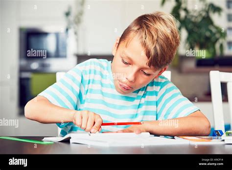 Little boy writing his homework for elementary school Stock Photo - Alamy