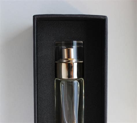 Premium Photo Perfume Unboxing Top Part Of Bottle Of Perfume In A