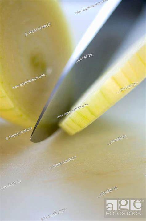 Slicing an onion, Stock Photo, Picture And Rights Managed Image. Pic ...