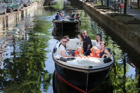 Delft: Open Boat Canal Cruise with Skipper | GetYourGuide