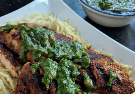 This Recipe From Food Network’s Bobby Flay Combines Grilled Chicken With A Verdant Herb Sauce