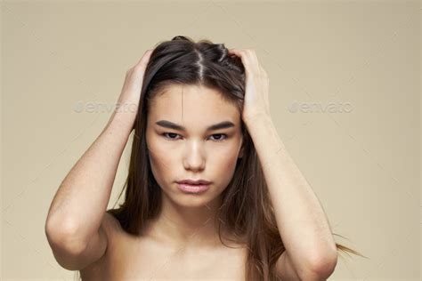 Pretty Woman Naked Shoulders Long Hair Body Care Beige Background Stock