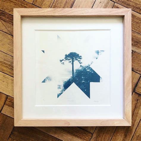 An Image Of A Palm Tree In The Middle Of A Frame On A Wooden Floor