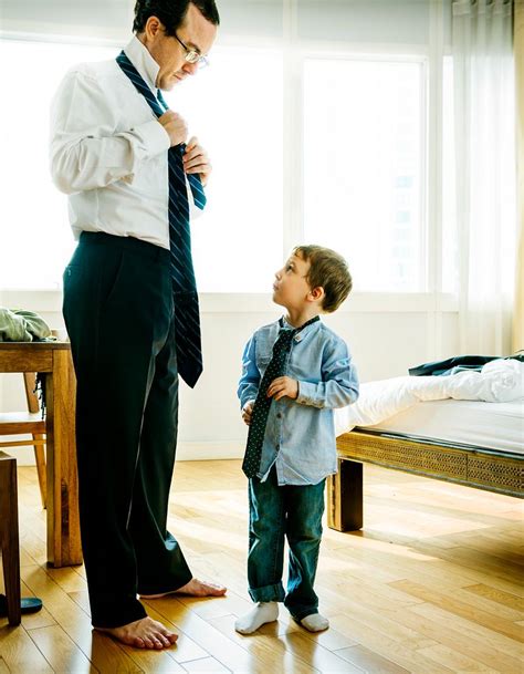 father teaching son    laptop royalty  stock photo