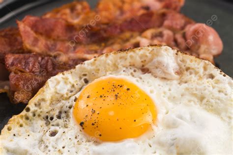 Fried Egg And Bacon Rashers Background Streaks Meal Photo And Picture