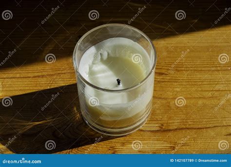 A White Candle In A Glass Jar Stock Image Image Of Sunny Close 142107789