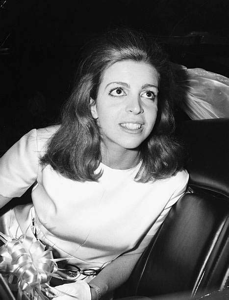 Black And White Photograph Of Woman Sitting In Car With Flowers On The