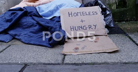 People Giving Money To The Homeless