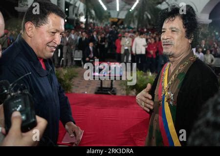 Libyan Leader Moammar Al Gaddafi Surrounded By Body Guards And Officers