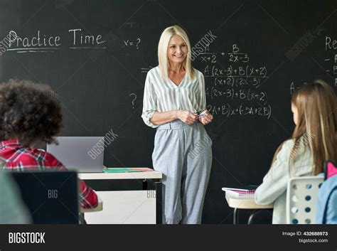 Blonde Teacher Standing