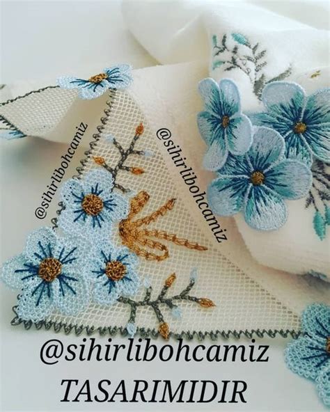 Some Blue Flowers Are Sitting On Top Of A White Cloth With The Words