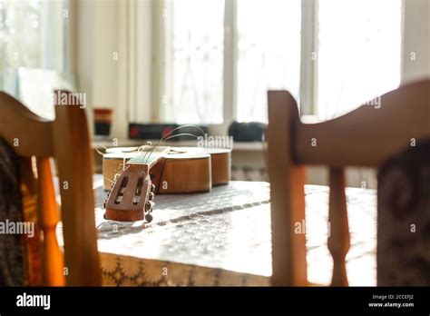 Broken Guitar With Torn Strings Stock Photo Alamy