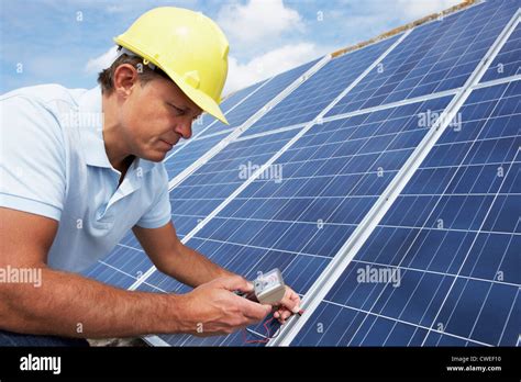 Man Installing Solar Panels Stock Photo Alamy