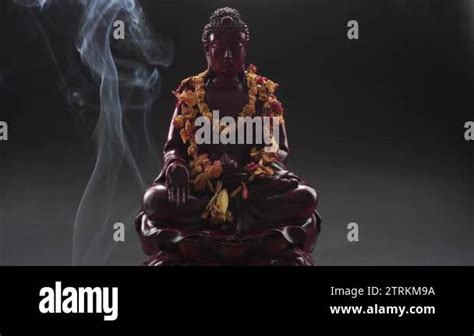 Buddha Statue With Incense Deity And Symbols Of Buddhism The Practice