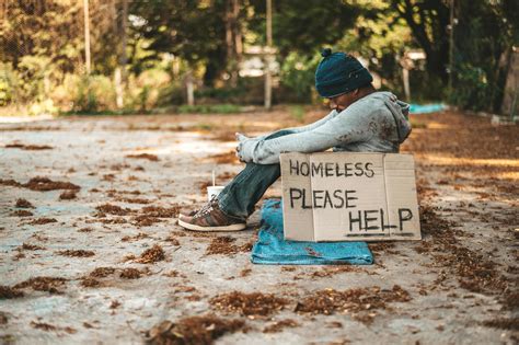 Beggar sitting on the street with homeless messages please help 1954639 ...