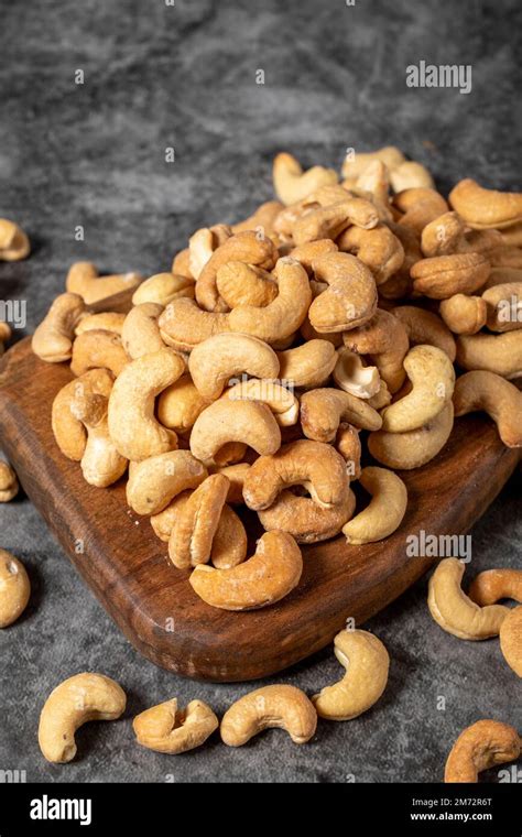 Cashew On Wood Serving Board A Pile Of Cashews Studio Shoot Close Up