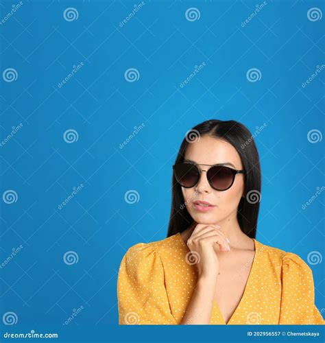 Beautiful Woman Wearing Sunglasses On Blue Background Space For Text Stock Image Image Of