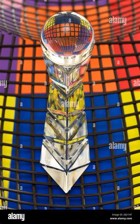 Glass Ball On Top Of A Crystal Pedestal Refracting Brightly Colored