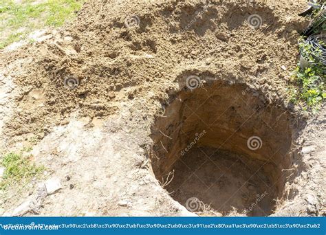 A Deep Hole is Dug in the Ground, a Sinkhole in the Ground Stock Image ...