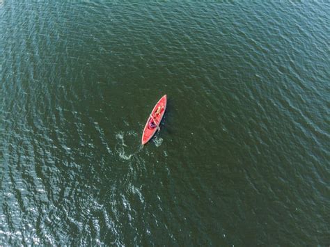 Premium Photo | Aerial drone top view kayaking in the sea