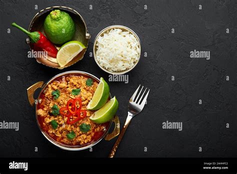 Achicken Keema In Traditional Indian Copper Kadai At Dark Slate