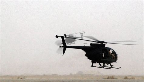 Two Us Army 160th Soar Ah 6j Little Bird Helicopters Take Off For A