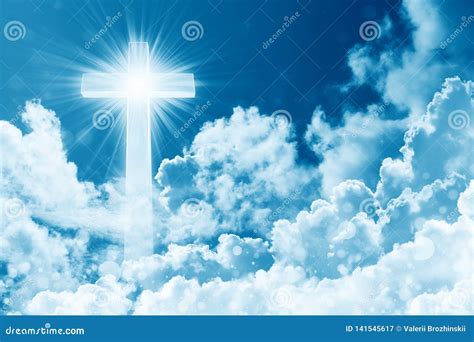 Concept Of Christian Religion Shining Cross On The Background Of Cloudy