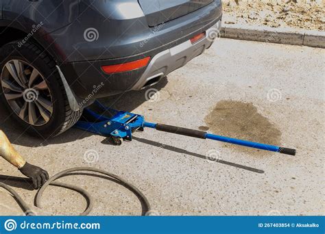 Hydraulic Car Jack Lift The New Car For Change The Tyre Stock Photo