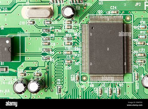 Green Electrical Circuit Board With Microchips Conductors And