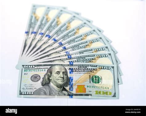 USD 100 dollars banknotes on a group of money isolated on white ...