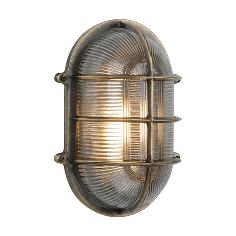 Outdoor Bulkhead Wall Light In Antique Brass With Ribbed Glass