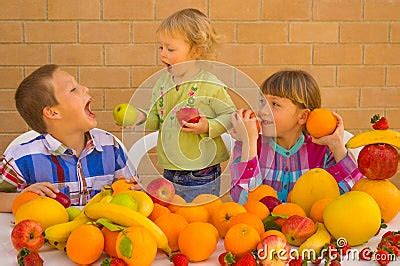 Children Eating Fruits Stock Photo | CartoonDealer.com #38144946