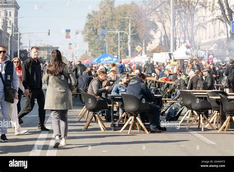 Chisinau, Moldova - October 15, 2022: People walk along Stefan cel Mare Avenue, eat street food ...