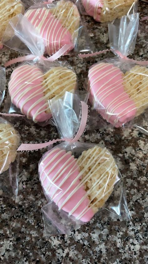 Heart Shaped Cookies Wrapped In Cellophane And Tied With Pink Ribbon On